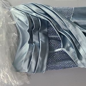 Beautiful blue formal gown. Front has some lil pulls as does bottom.